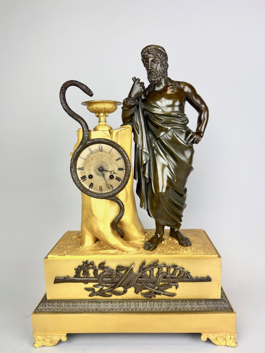 Empire Clock In Gilded And Patinated Bronze Representing Aesculapius