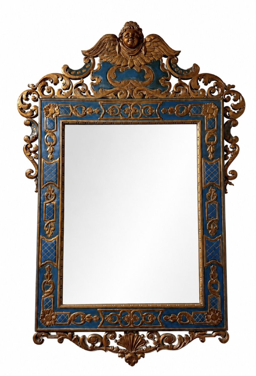 A Carved And Gilded Wooden Mirror Featuring Rich Baroque-inspired Decoration 