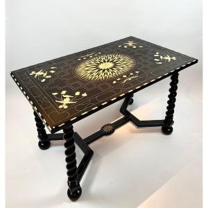 An 18th Century Central Table In Ebonized Wood And Inlaid With Bone.