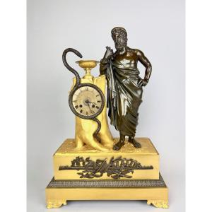 Empire Clock In Gilded And Patinated Bronze Representing Aesculapius