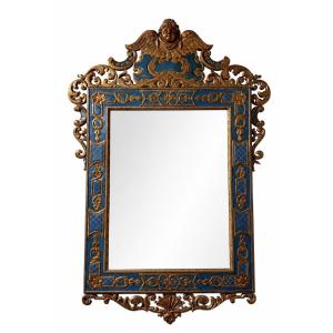 A Carved And Gilded Wooden Mirror Featuring Rich Baroque-inspired Decoration 