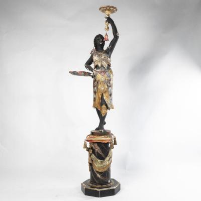 Porte torchère à la Nubienne en bois et stuc polychrome et doré et inclusions de verres, XIXe