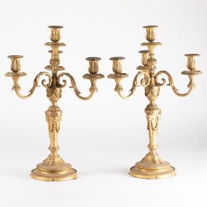 Paire de chandeliers aux têtes de lion en bronze doré, XIXe