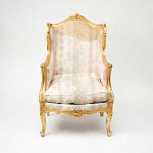 Bergère à oreilles en bois sculpté et doré, XIXe