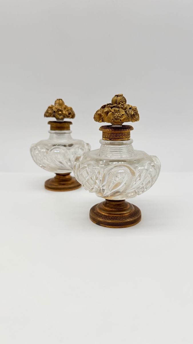 Pair Of Baccarat Perfume Bottles With A Floral Bronze Lids.-photo-2