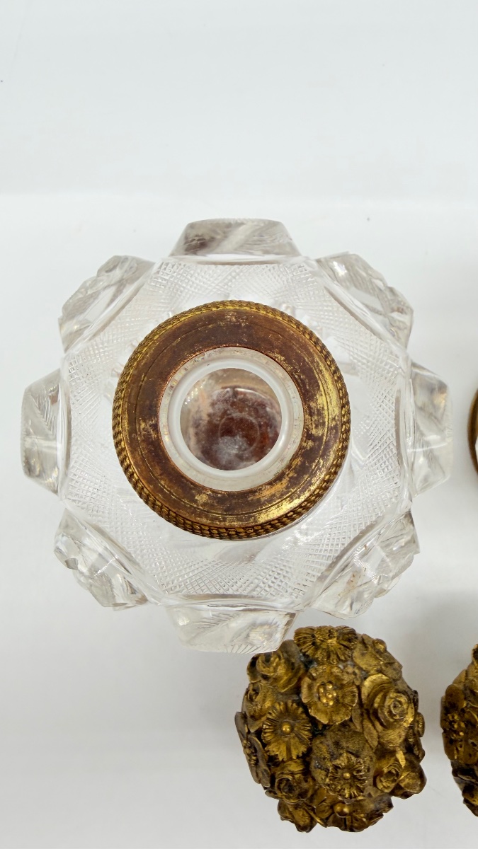 Pair Of Baccarat Perfume Bottles With A Floral Bronze Lids.-photo-1