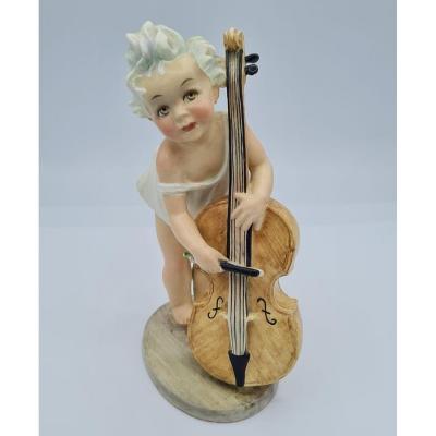 Arturo Pannunzio (1891-1953), Petite fille au violoncelle, figurine en céramique