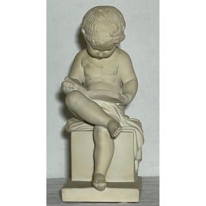 Sculpture De L’enfant Liseur