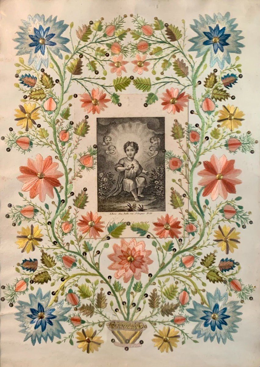 Brodé sur papier avec fil de soie et image de dévotion. Premier tiers du XIXe siècle.