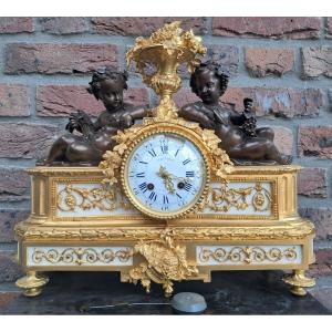 Gilt Bronze Clock. Signed Quesne.