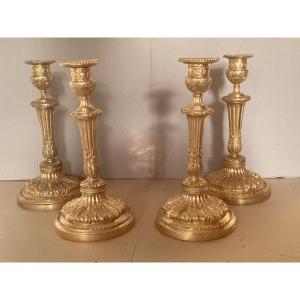 Meeting Of Four 18th Century Candlesticks 