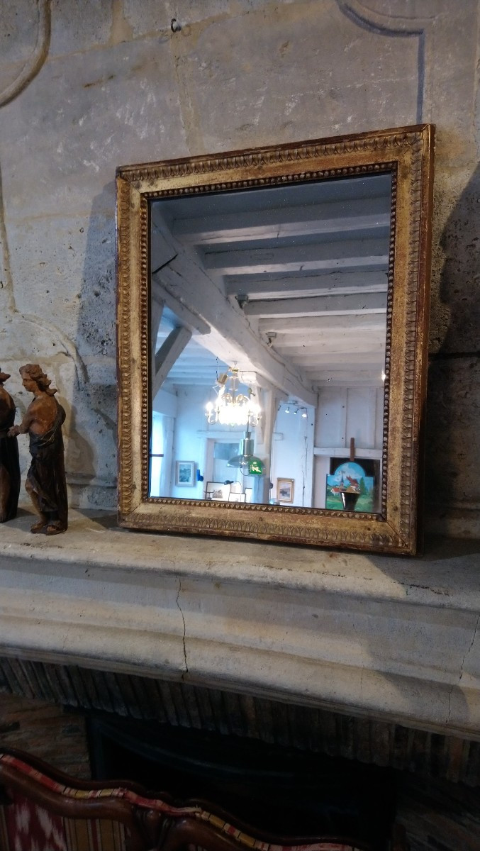 Miroir en bois doré fin 18e début 19e 