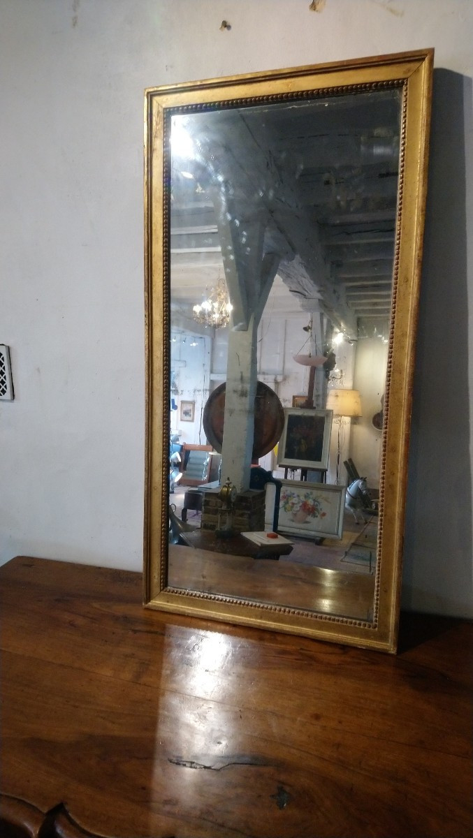 Miroir d entre deux en bois doré fin 18e début 19e 