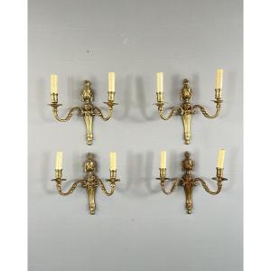 Suite de quatre appliques en bronze, style Louis XVI, XXe siècle