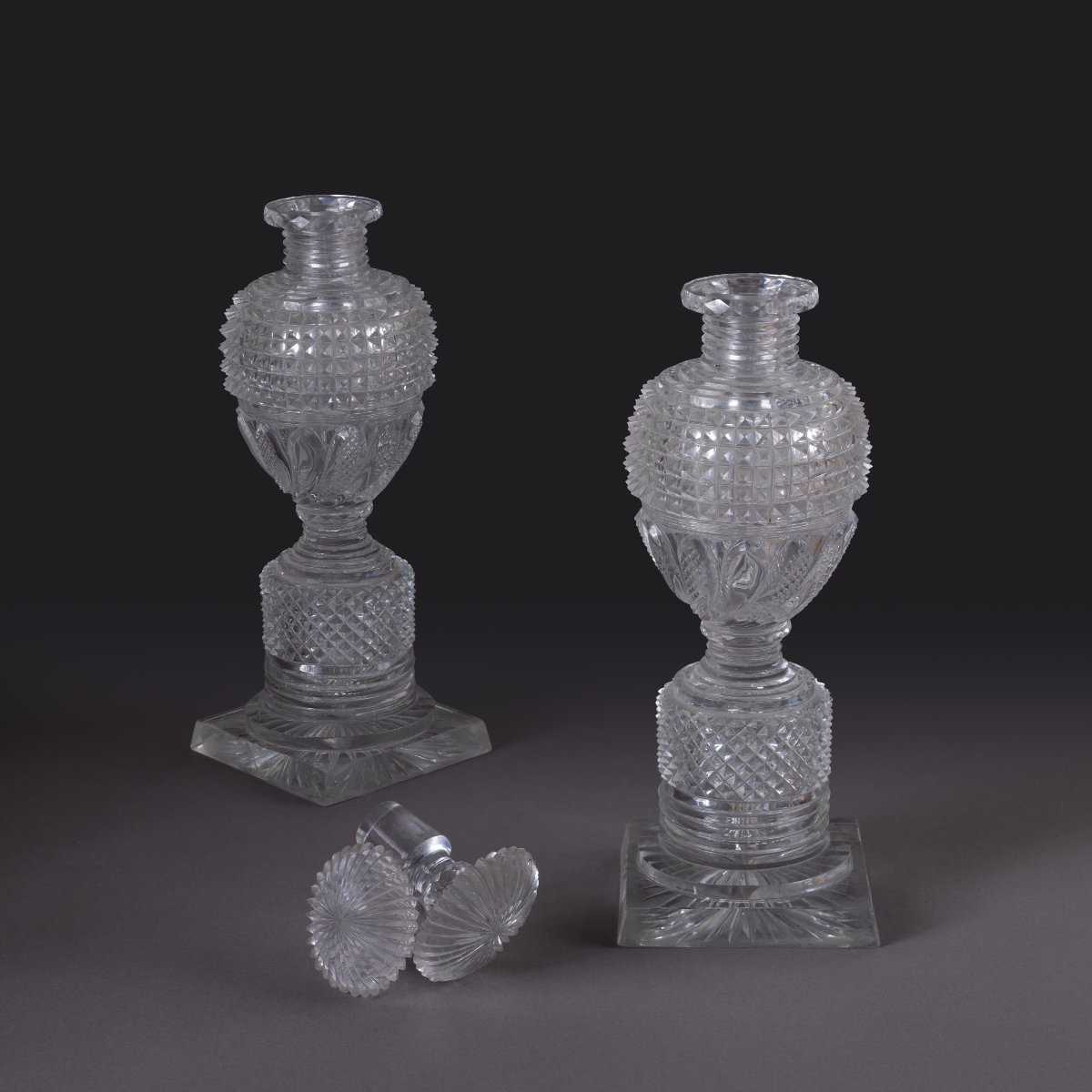 Le Creusot, Circa 1830—a Pair Of Large, Lidded Bottles Made Of Cut Crystal—charles X