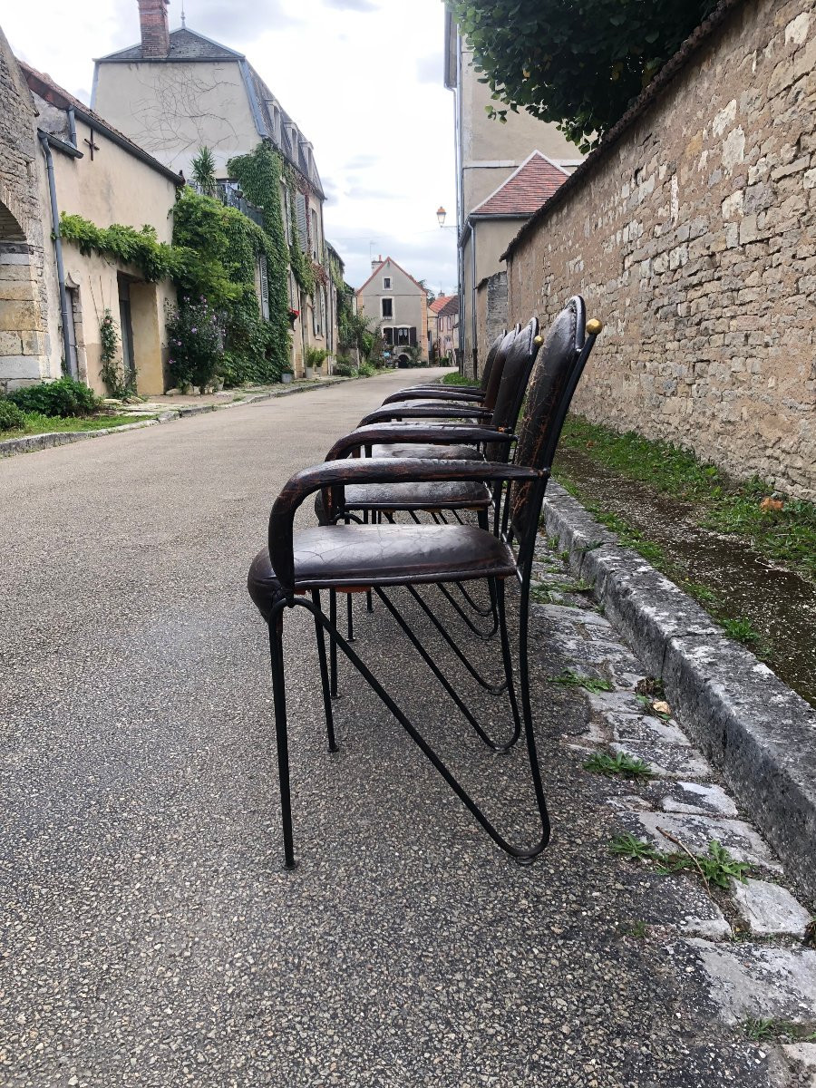 Suite de quatre fauteuils en fer, laiton et cuir par jacques adnet.-photo-1