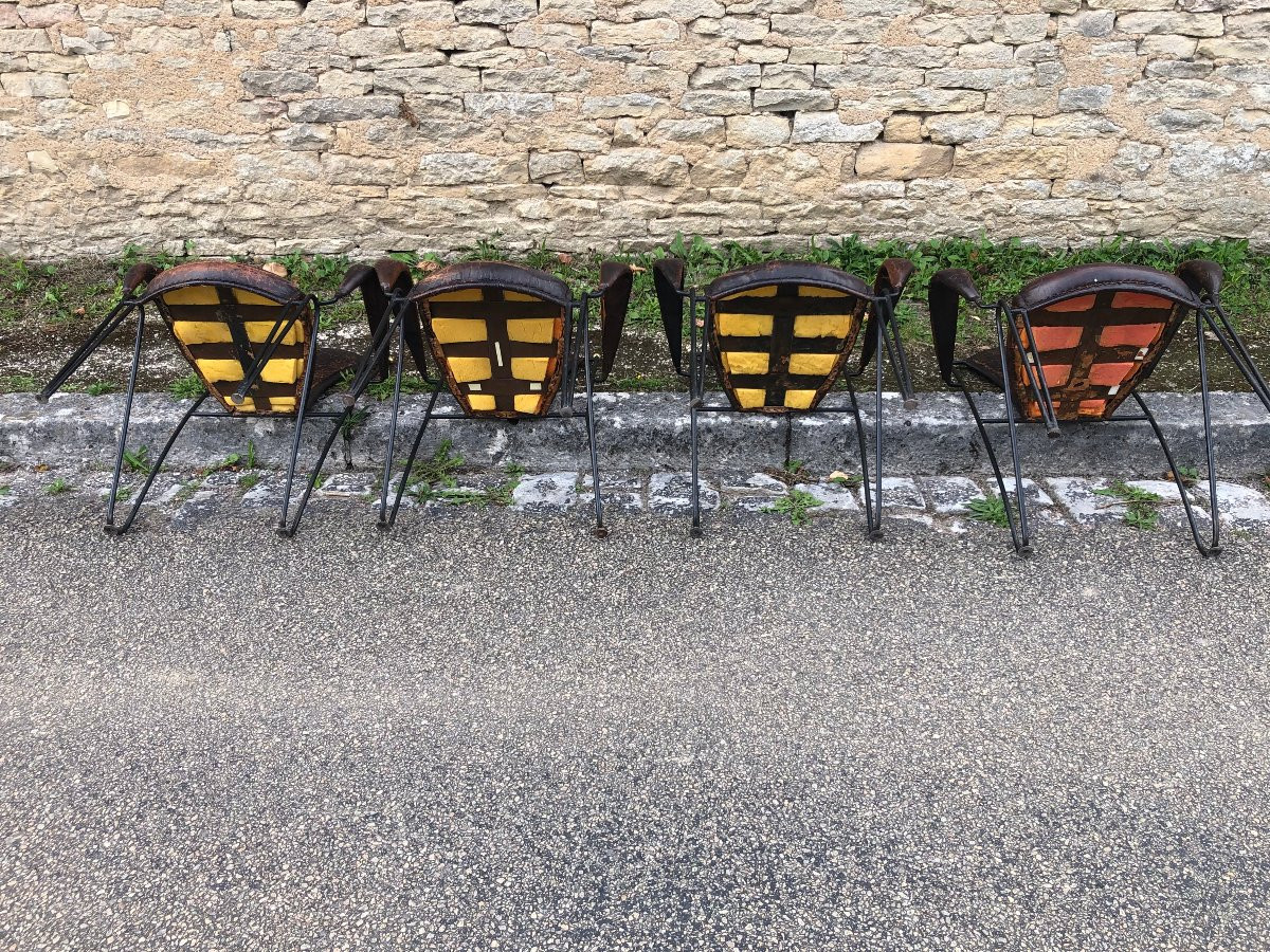 Suite de quatre fauteuils en fer, laiton et cuir par jacques adnet.-photo-3