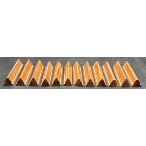 UNE SÉRIE DE DOUZE PORTES COUTEAUX EN PALISSANDRE ET FILET DE BAKÉLITE ANNÉES 1930 FRANÇAIS 