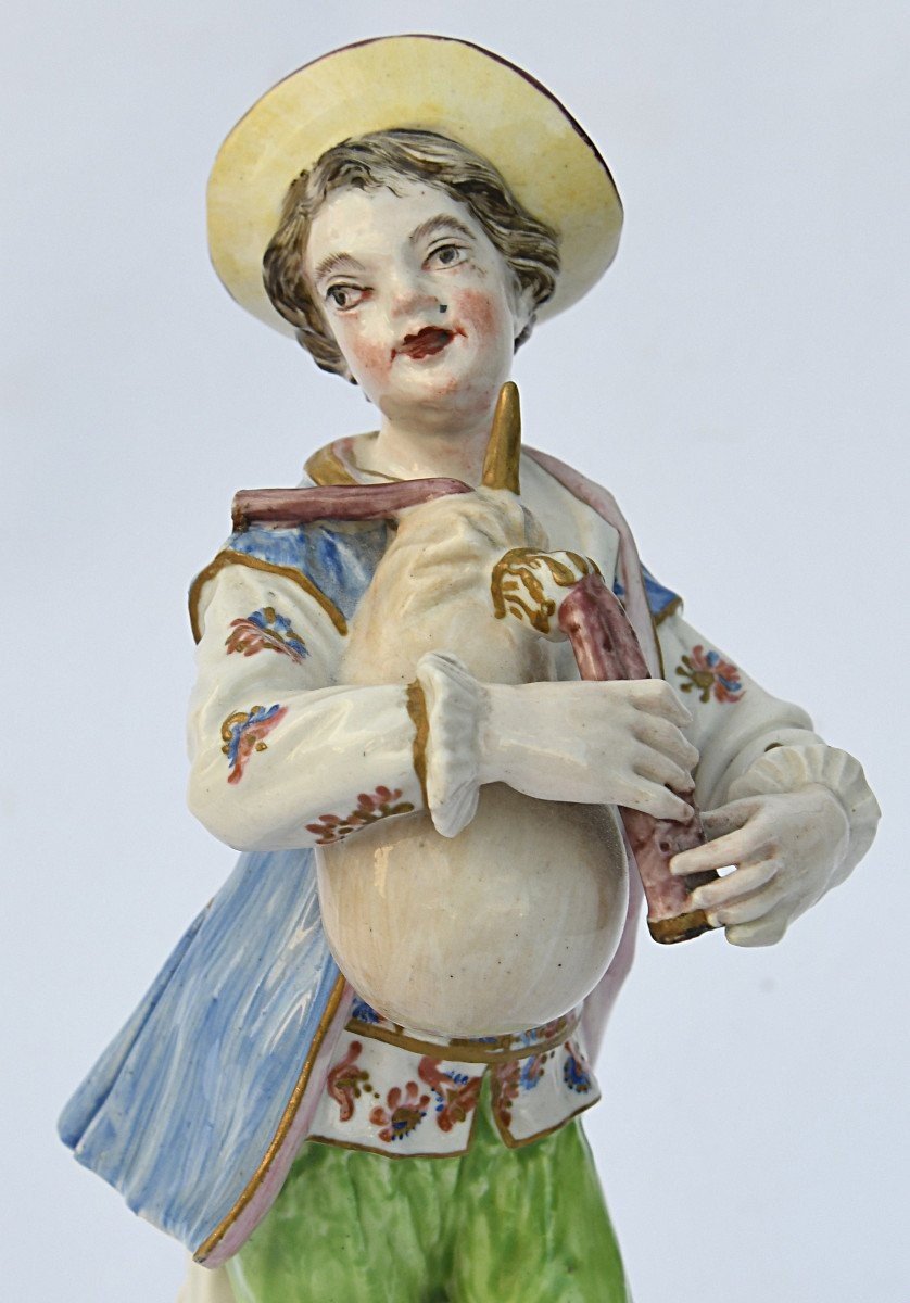 Porcelain Statuette A Young Boy Playing The Bagpipes -photo-2