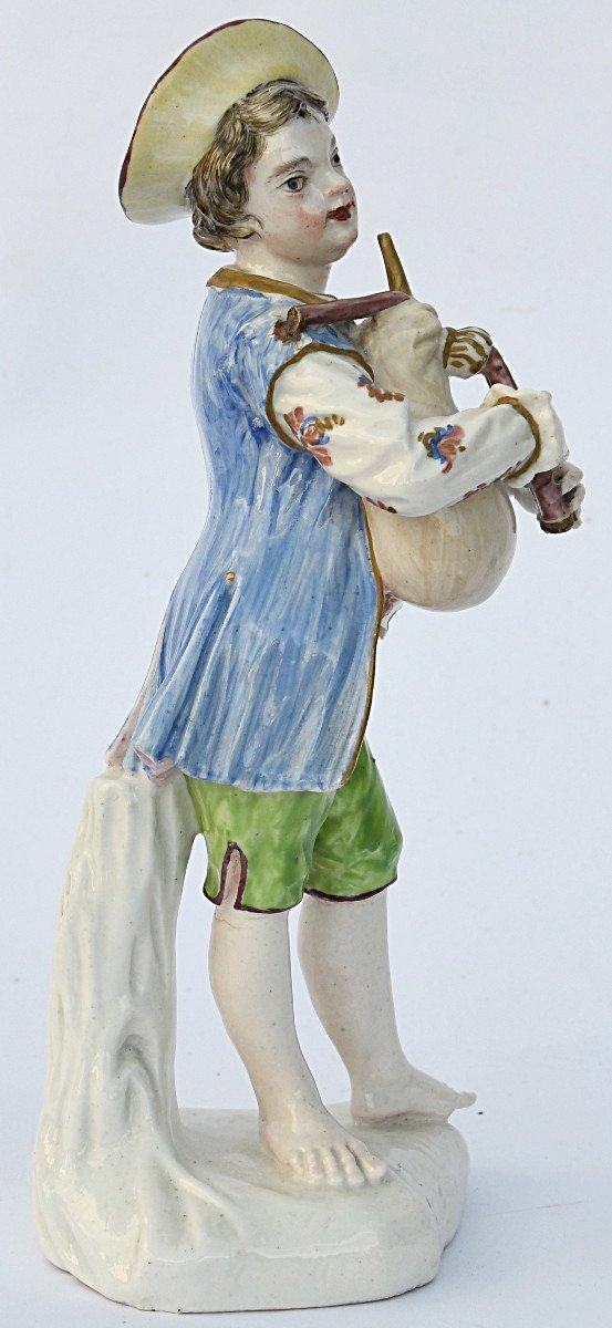 Porcelain Statuette A Young Boy Playing The Bagpipes -photo-3