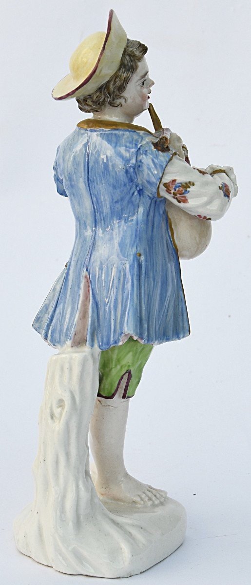 Porcelain Statuette A Young Boy Playing The Bagpipes -photo-1