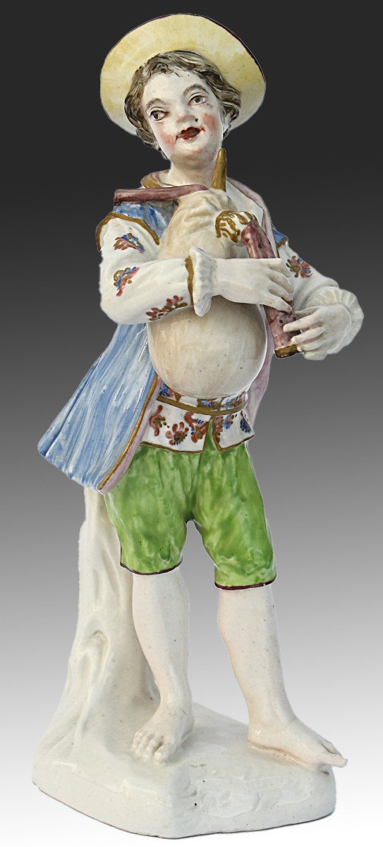 Porcelain Statuette A Young Boy Playing The Bagpipes 