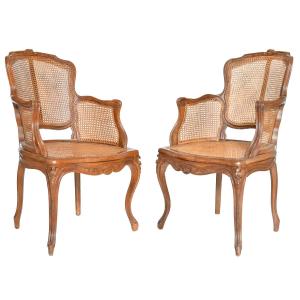 Paire de fauteuils bergères cannés de style Louis XV 