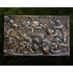 Plaquette en bronze d'après Duquesnoy représentant une bacchanale de putti