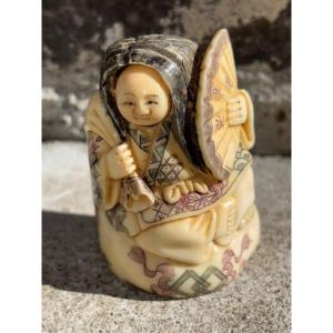 Netsuke ivoire polychrome deux  visages mobiles
