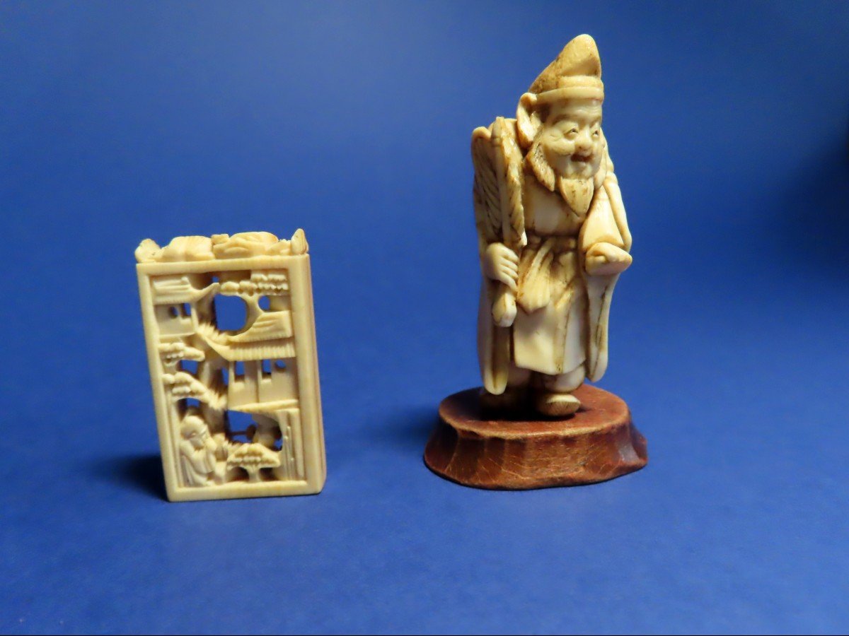 An Ivory Okimono And Netsuke. Daikoku And An Abacus. Japan, Meiji Period (1868-1912)