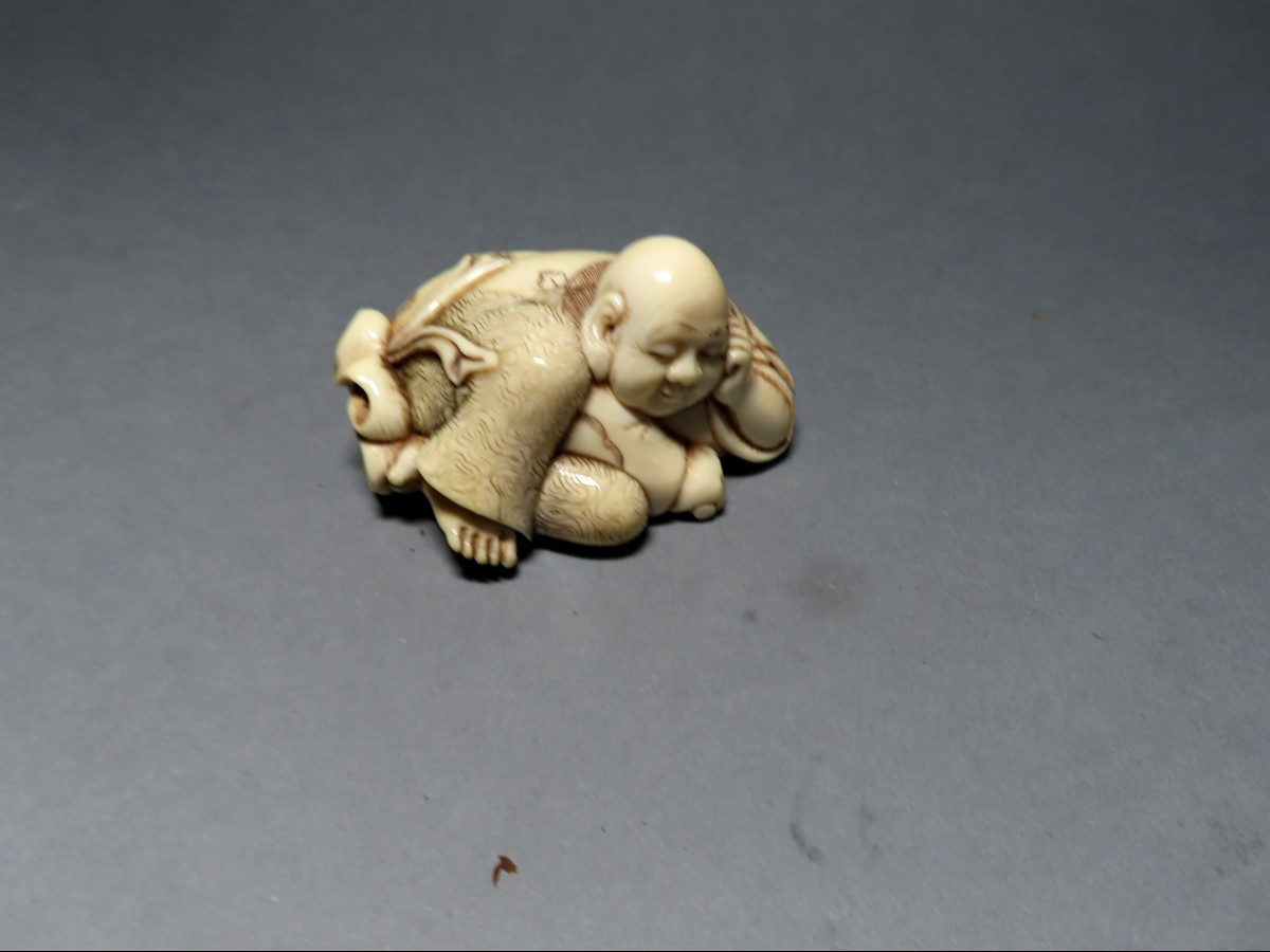 Ivory Okimono. Hotei And His Bag Of Riches. Japan, Late Meiji - Early Taisho. Signed Jusan.