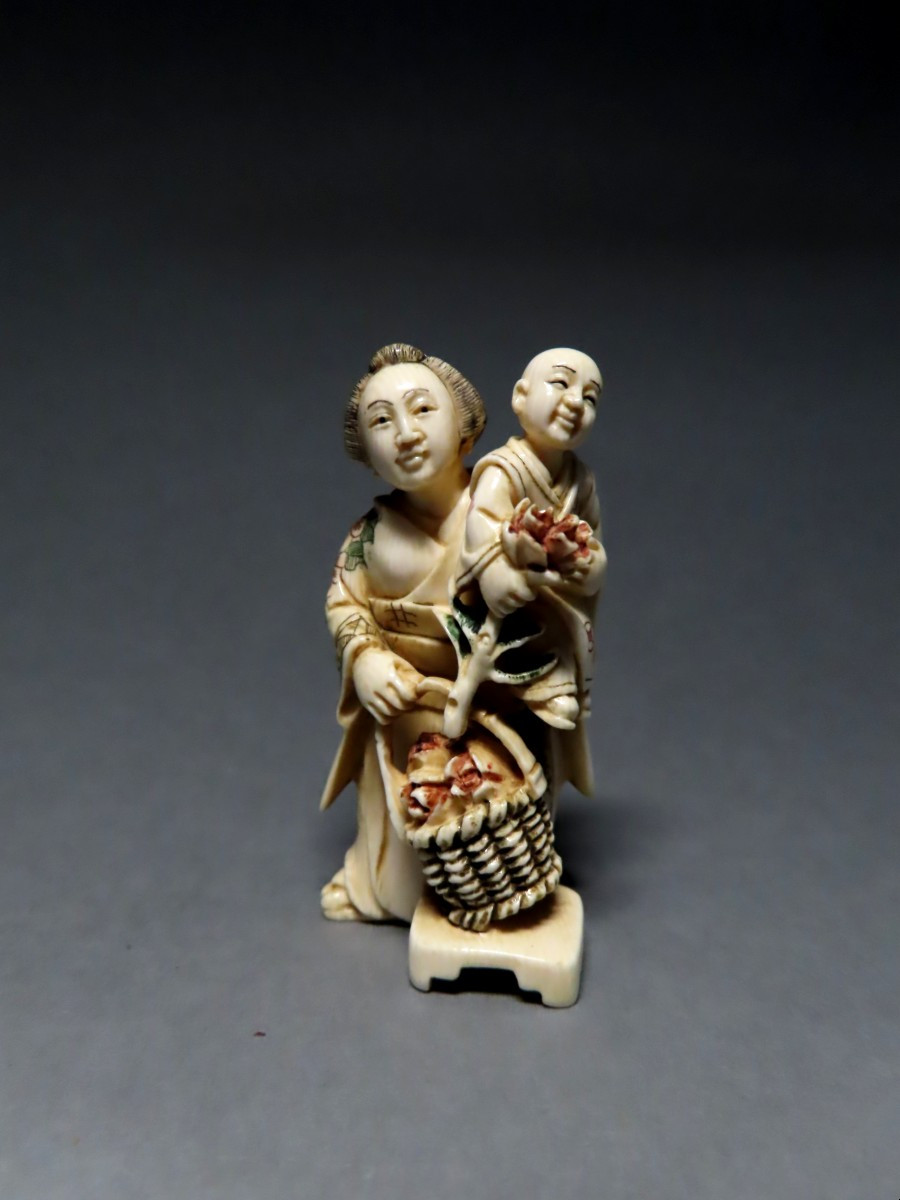 Ivory Netsuke. The Little Flower Seller. Japan, Taisho Period (1912-1928)