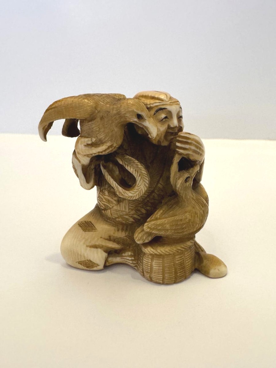 Netsuke en ivoire. Pêcheur aux cormorans. Gyokuyuki . Japon époque Meiji (1868-1912 )