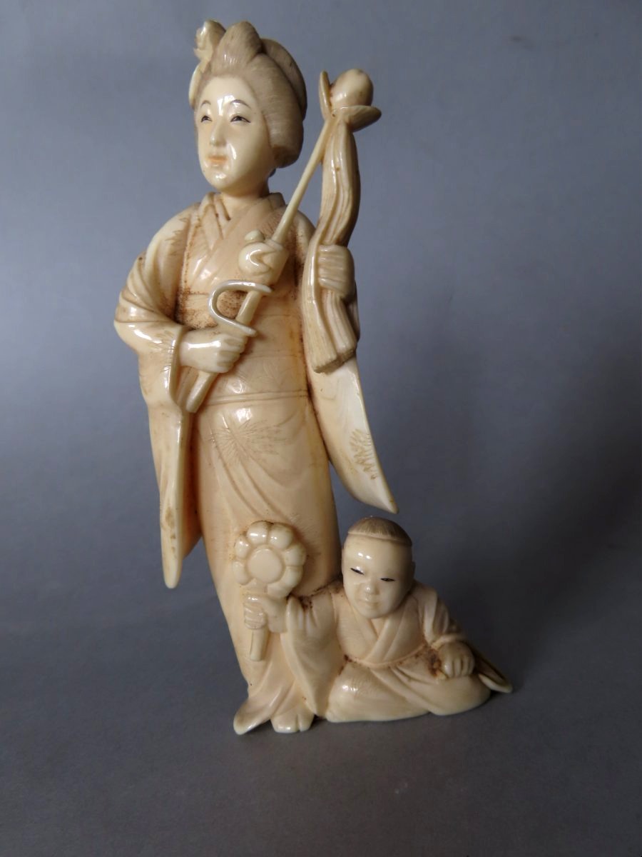 Ivory Okimono... Woman With A Lotus Flower. Meiji Period, Japan (1868–1912)