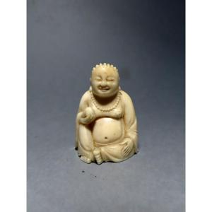 Ivory Okimono. Smiling Deity. China 1920-30