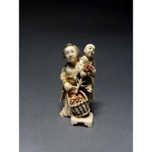 Ivory Netsuke. The Little Flower Seller. Japan, Taisho Period (1912-1928)