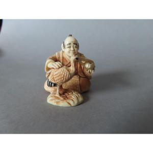 Netsuke Made Of Marine Ivory. A Crane Having Lunch. Japan, Taisho Period (1912–1928)