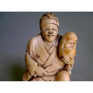 Ivory Okimono. Artisan And Daruma Doll. Japan Meiji Period.