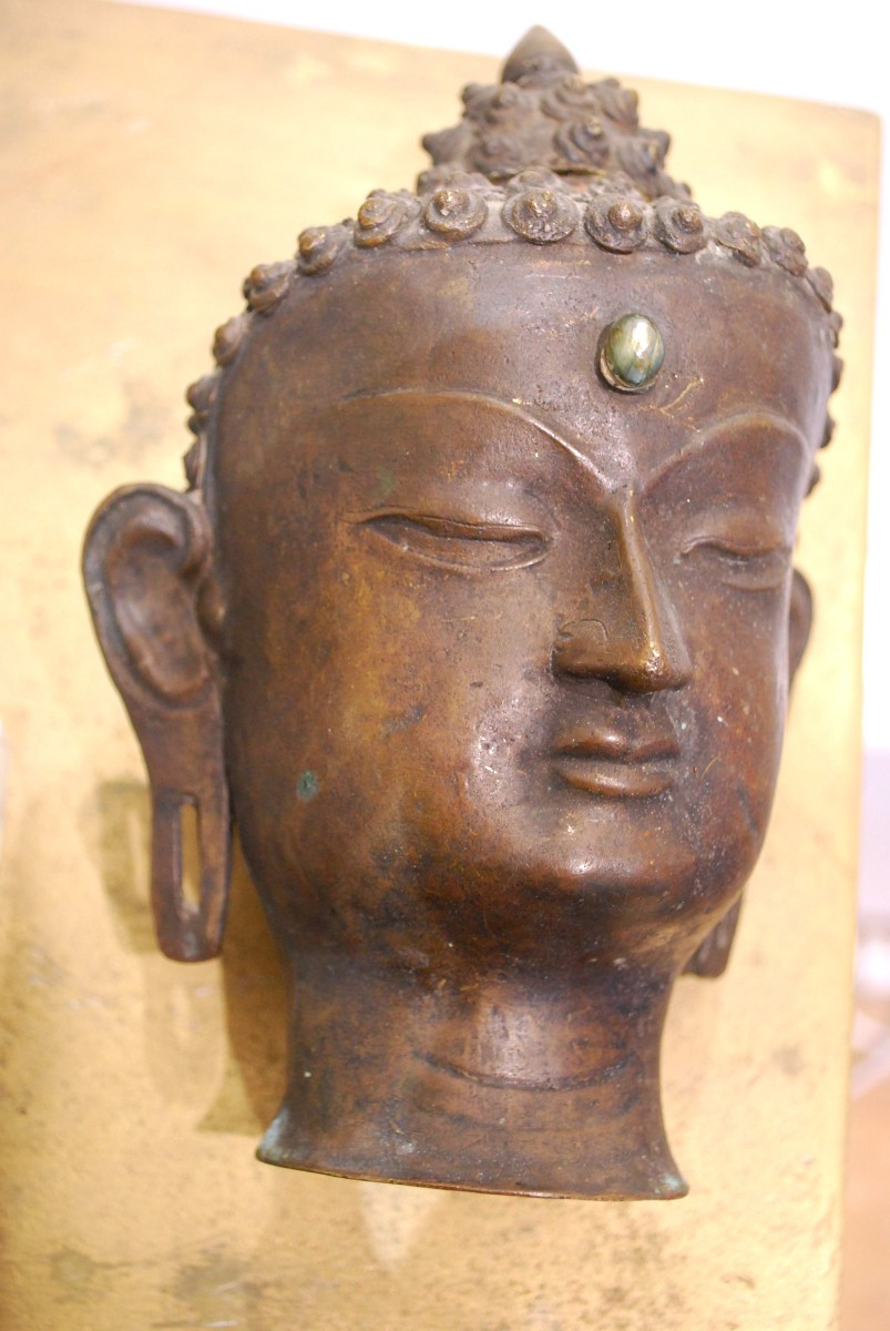 A Bronze Head Of Buddha