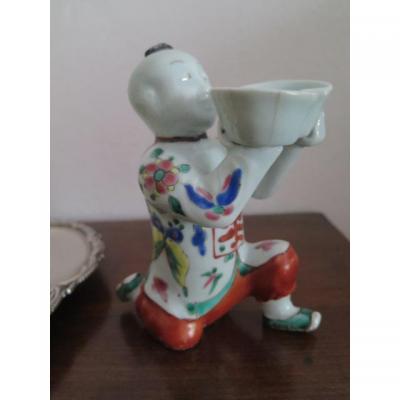 Chinese Magot Holding A Cup