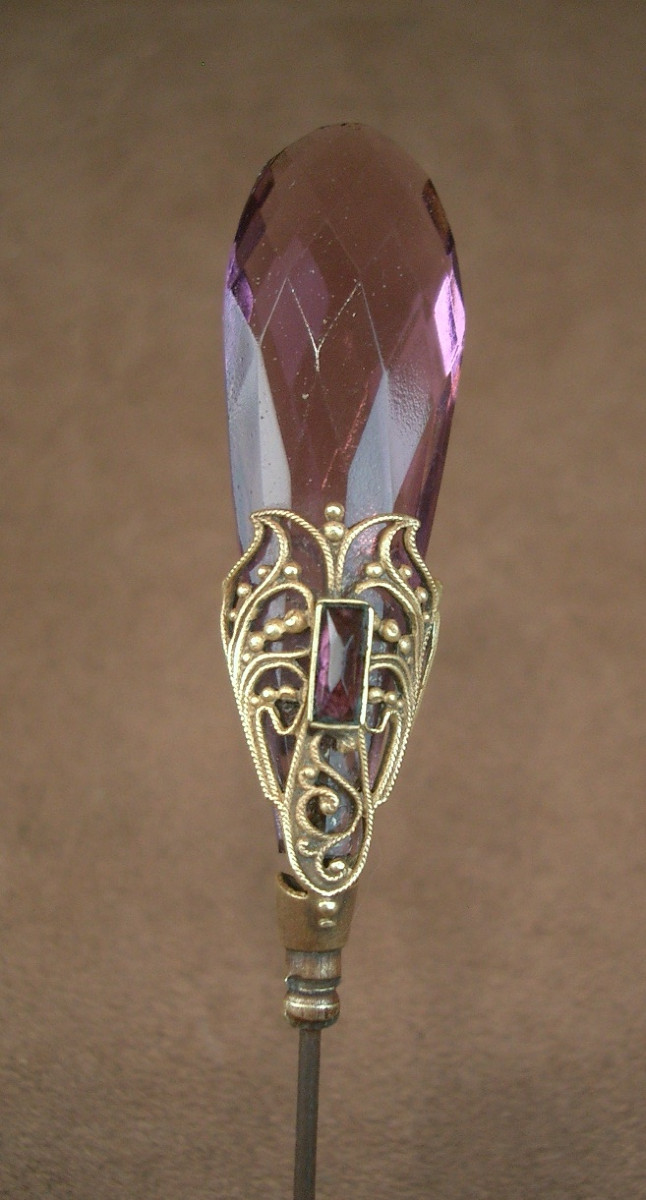 Art Nouveau Purplish Glass Hatpin With Gilded Metal Butterfly Motif