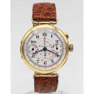 Montre UNIVERSAL chronographe mono-poussoir. En or 18K. Vers 1930