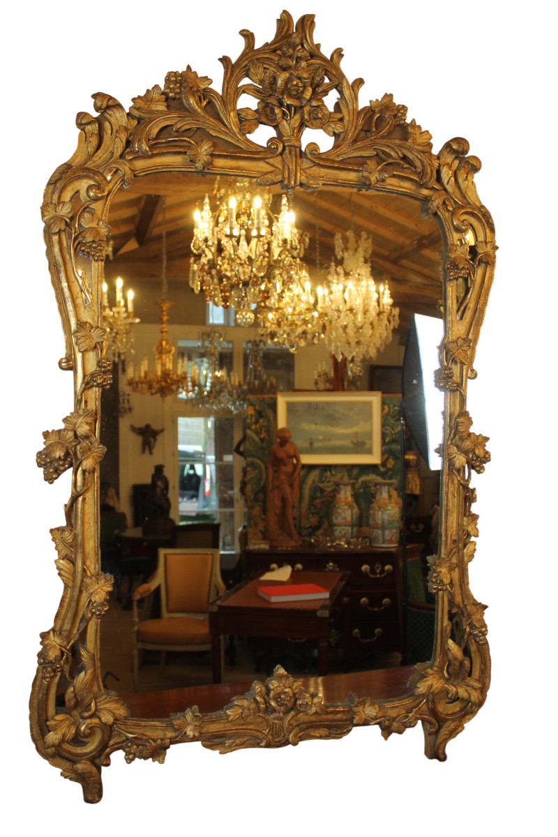 Grand miroir à parecloses en bois doré, époque Louis XV