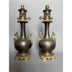Paire de lampes à pétrole en métal patiné et bronze doré – XIXème siècle