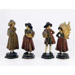 Les Quatre Saisons - sujets d'applique en bois sculpté polychrome, Allemagne ou Autriche, XIXe