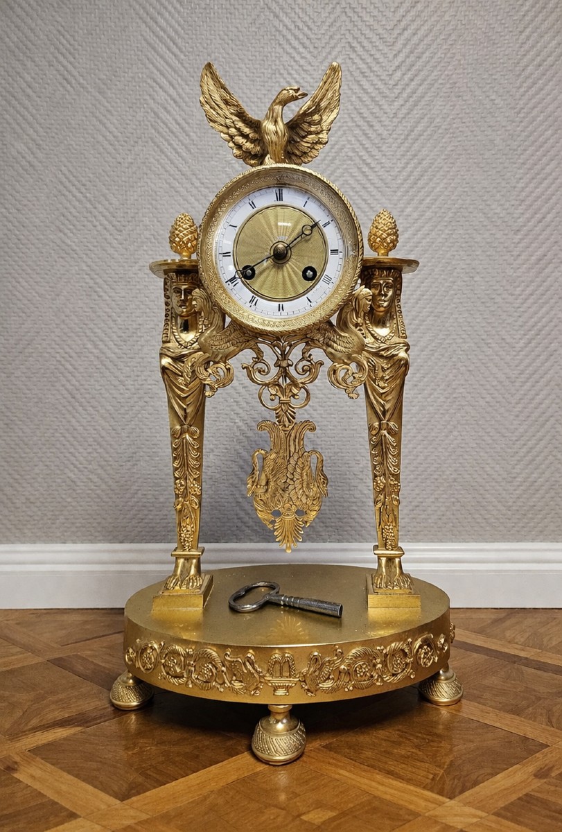 A Finely Chased And Gilded Bronze Portico Clock, Empire Period, Circa 1800