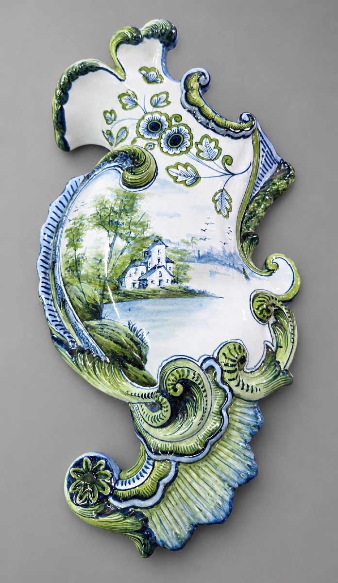 Wall-mounted Earthenware Bouquetiere With Polychrome Decoration, In An Animated Form.
