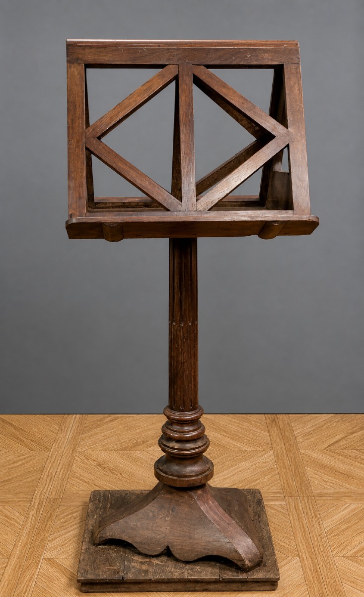 Large Solid Oak Music Stand Resting On A Central Turned Base With A Trilobed Base