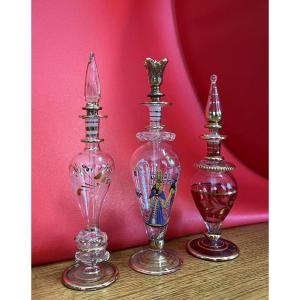 Three Translucent Glass Bottles With Gold Highlights   