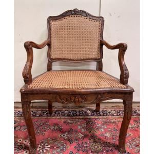 Fauteuil de bureau époque Louis XV en noyer sculpté